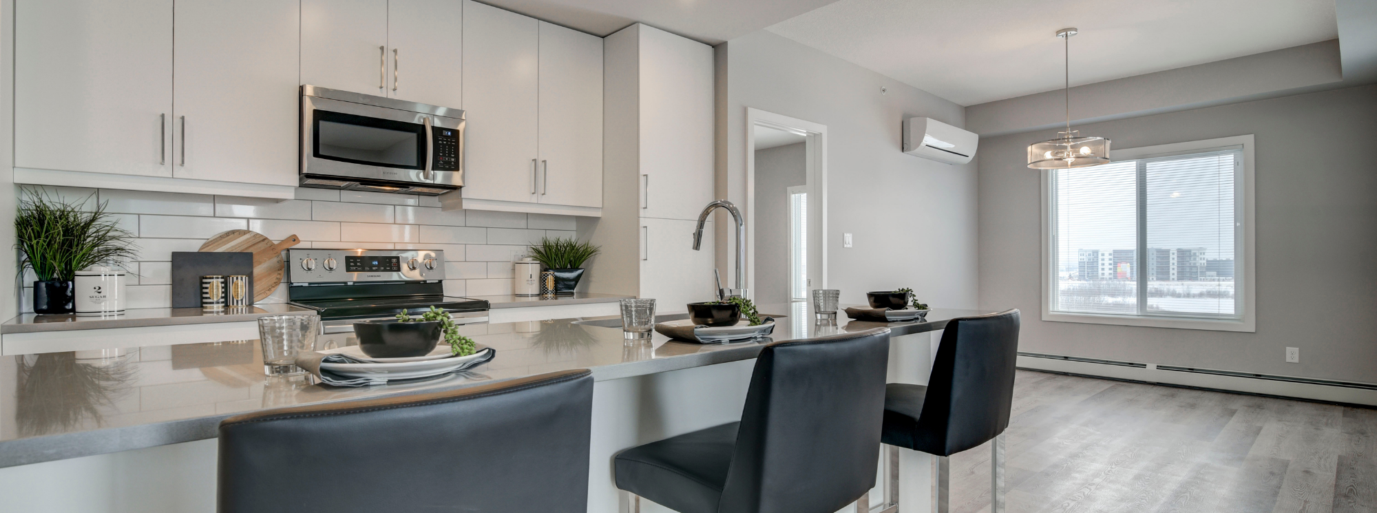 Sora open concept kitchen in white package overlooking dining room
