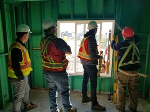 Our team inspecting the integrity of the window framing